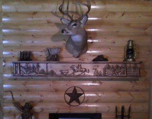 Cowboy Roundup fireplace mantel installed in a cabin.