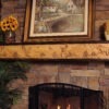 Wildlife Chorus fireplace mantel with 8 point buck, bear and eagle mountain scene.