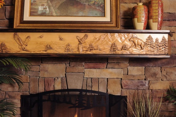 Wildlife Chorus fireplace mantel closeup with 8 point buck and eagle mountain scene.