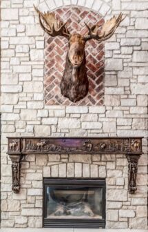 Moose elk fireplace mantel